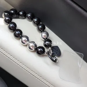 Beaded phone charm design with heart pendant