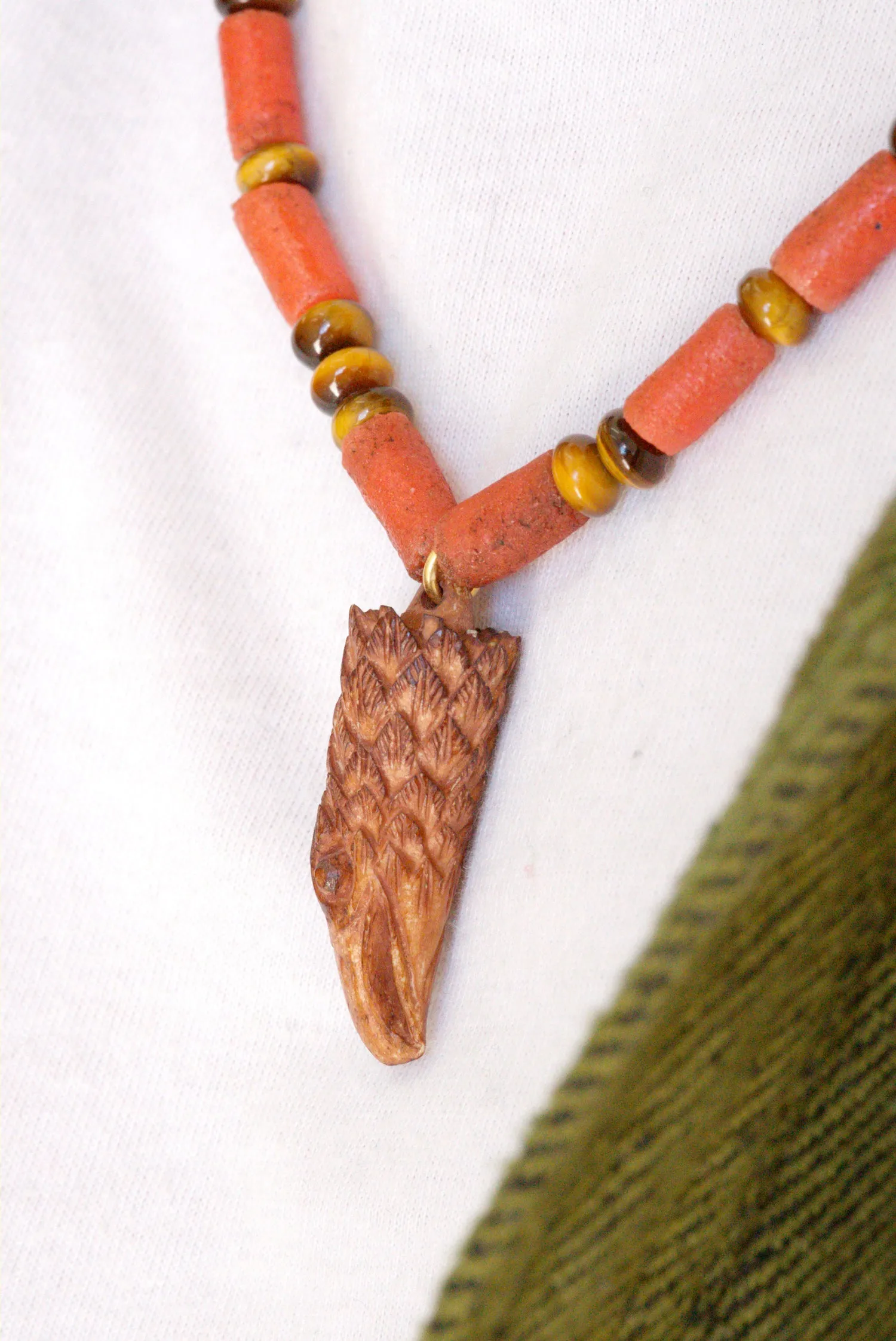 Carved eagle head necklace