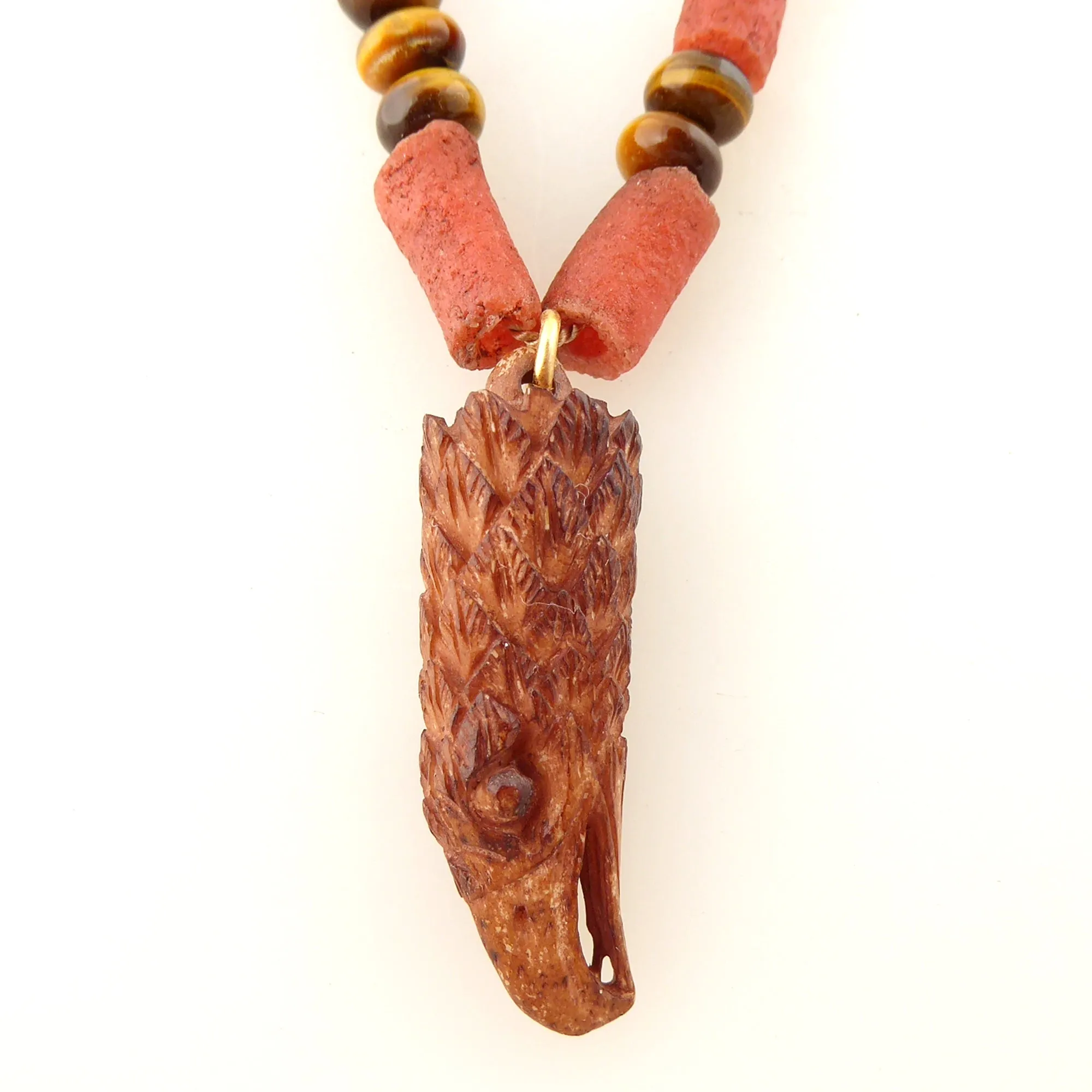 Carved eagle head necklace