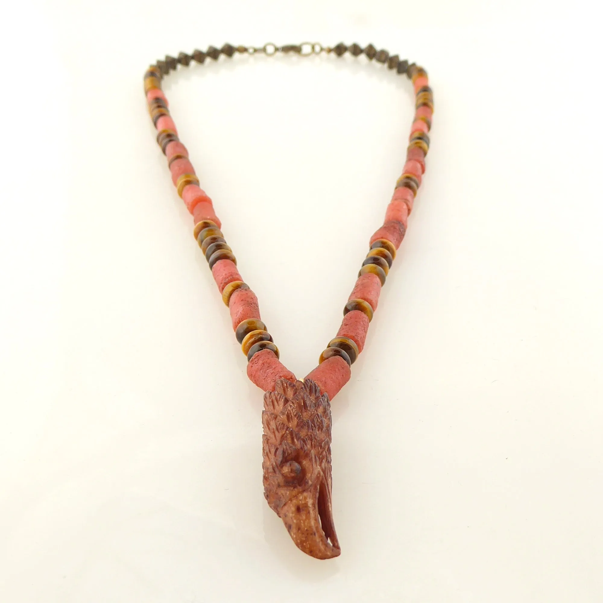 Carved eagle head necklace