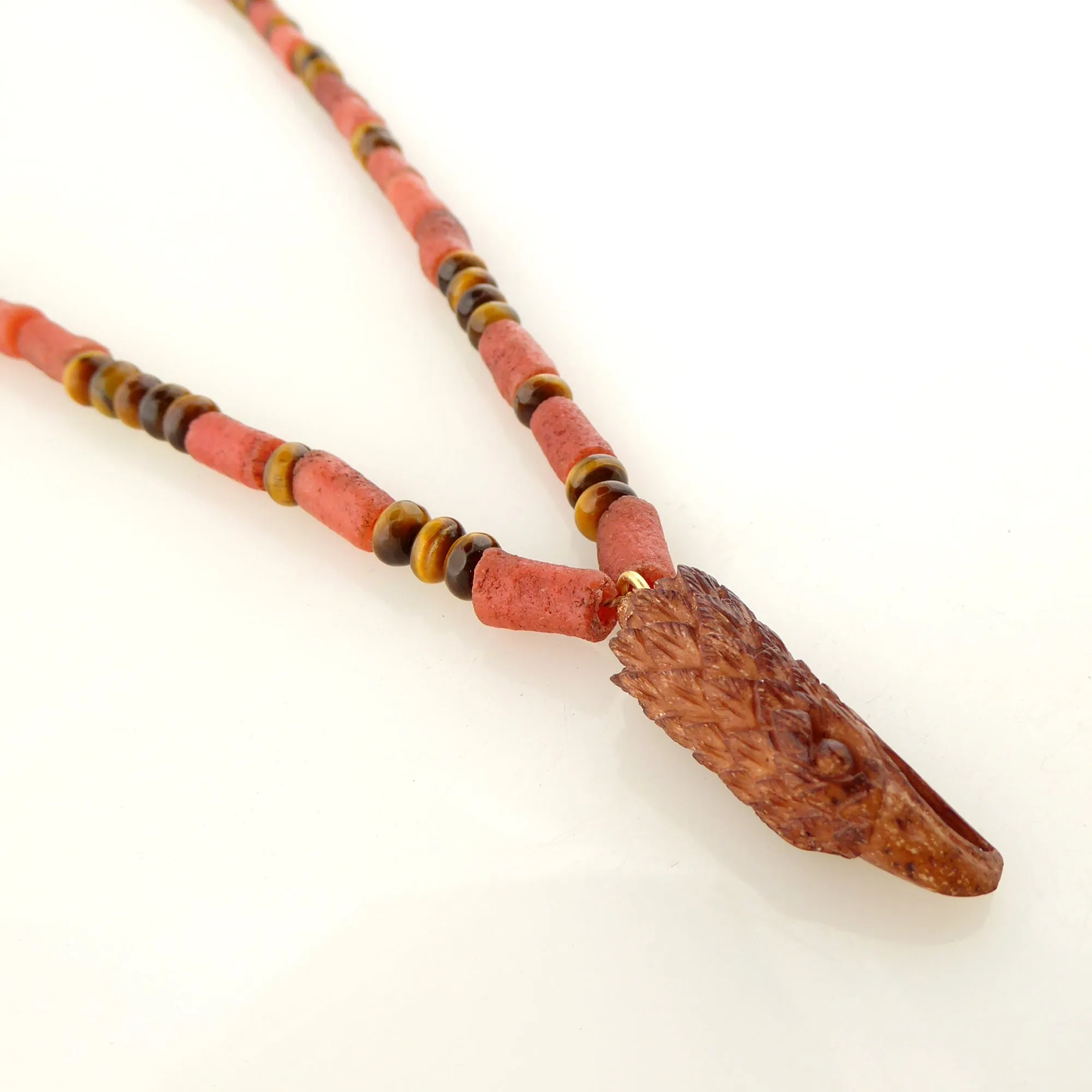 Carved eagle head necklace