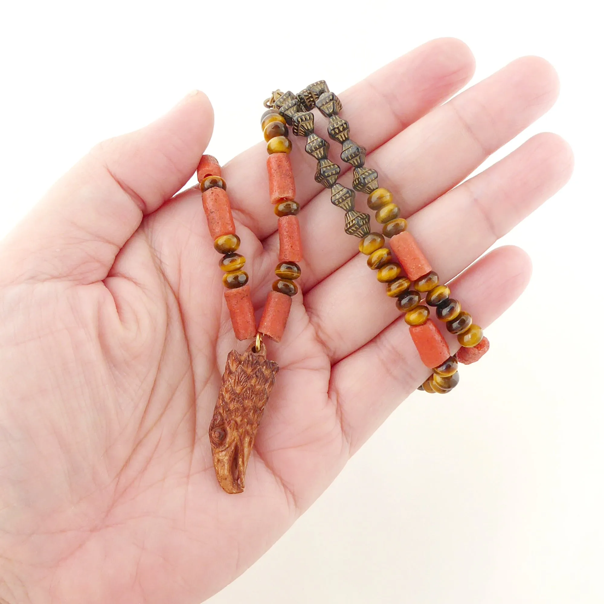 Carved eagle head necklace